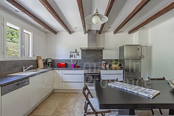 A kitchen with the word made in provence on the wall