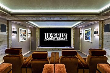 A lucasfilm logo is on a screen in a theater