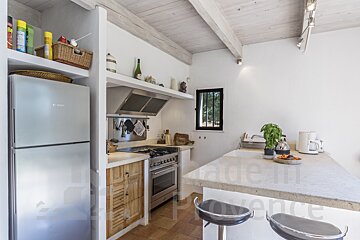 A kitchen with a bosch refrigerator and a stove
