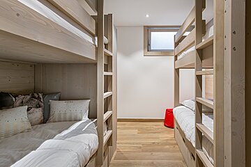 A bunk bed with a pillow that says ' i love you ' on it