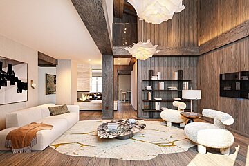 A chic modern living room features wood-paneled walls, exposed beams, white contemporary furniture, abstract art, and unique floral pendant lights.