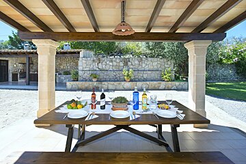 A table with plates and wine bottles on it