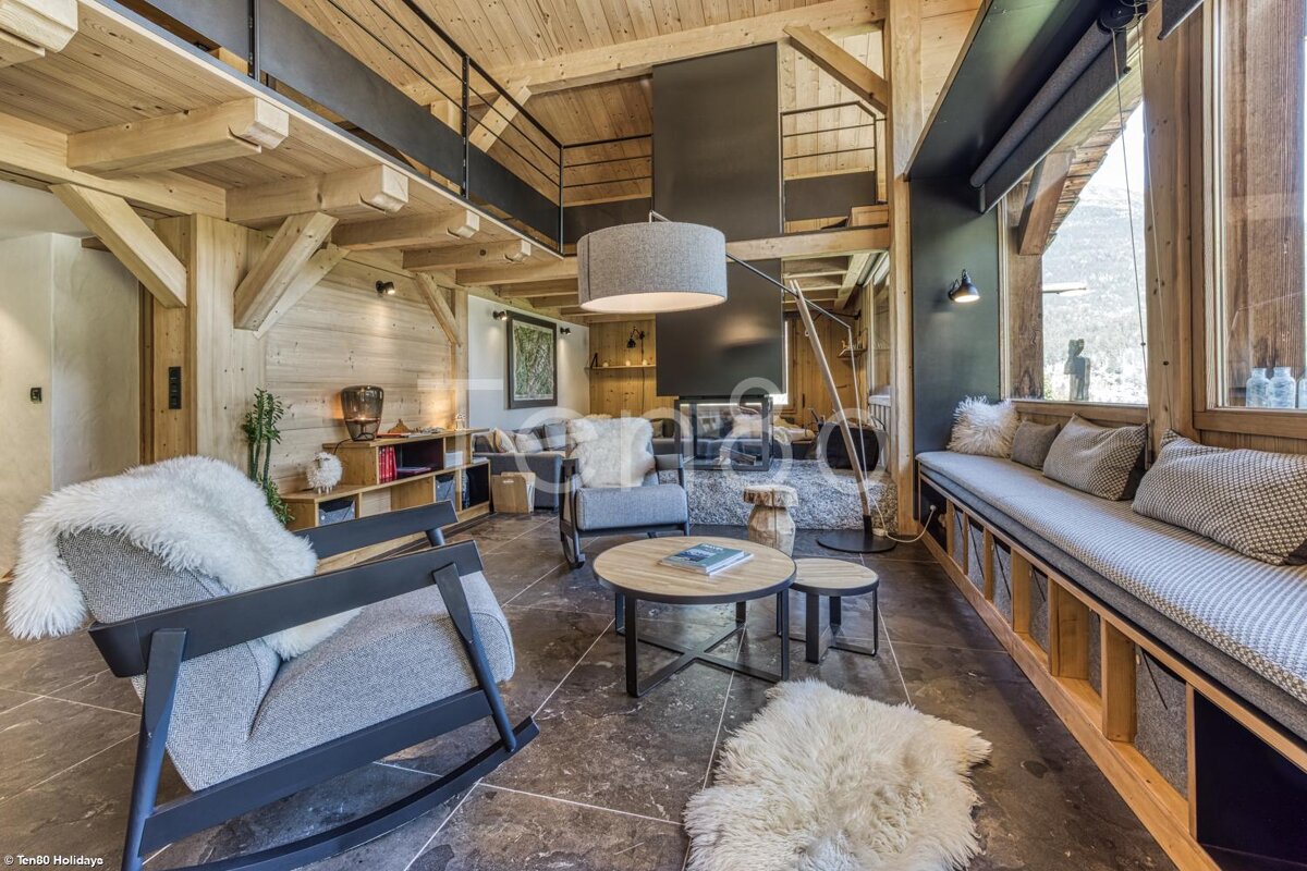 A living room with a rocking chair and a couch