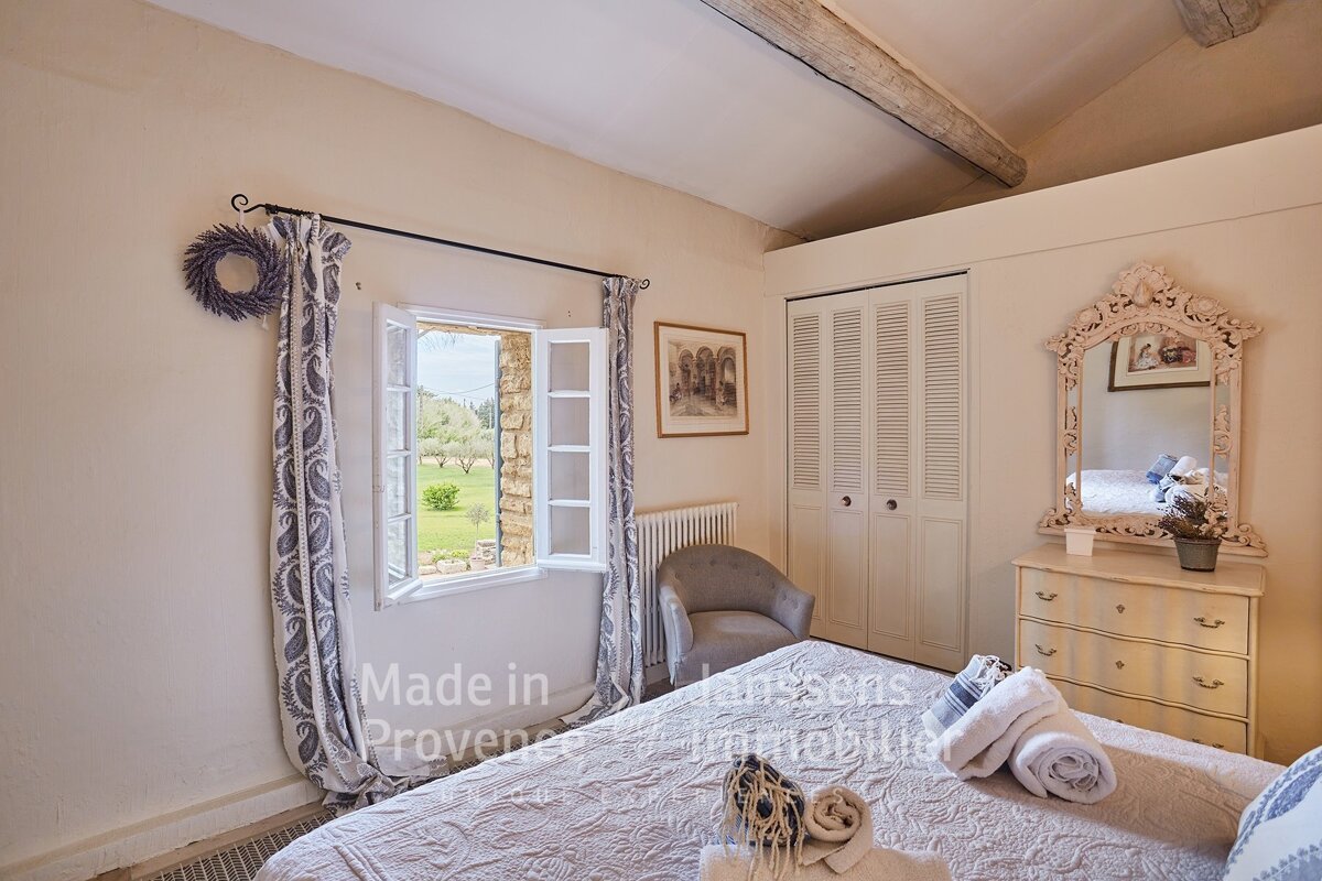 A bedroom with the words made in provence on the wall