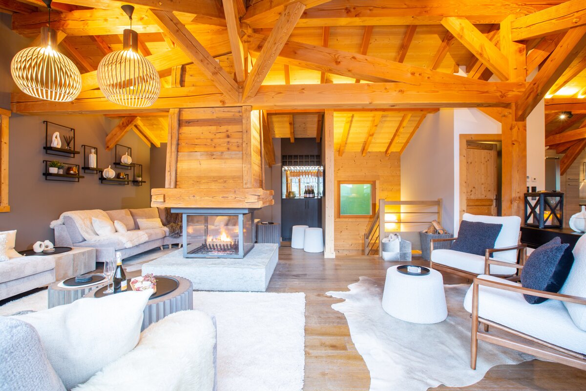 A living room filled with furniture and a fireplace