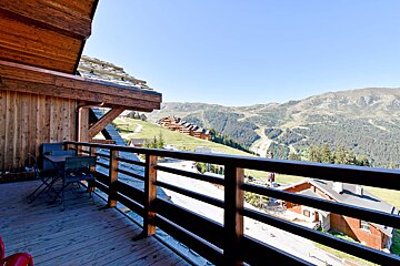 A balcony with a view of a mountain range