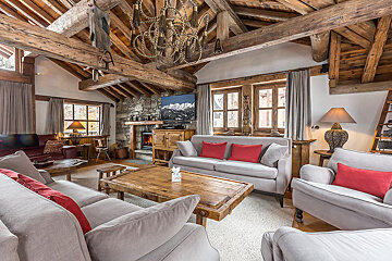 A living room filled with furniture and a television