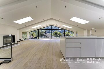 A kitchen with a large window and a sign that says mountain base