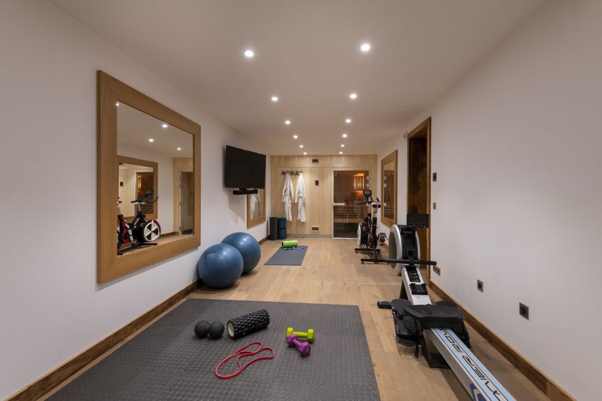 A gym with a rowing machine that says nordictrack on it