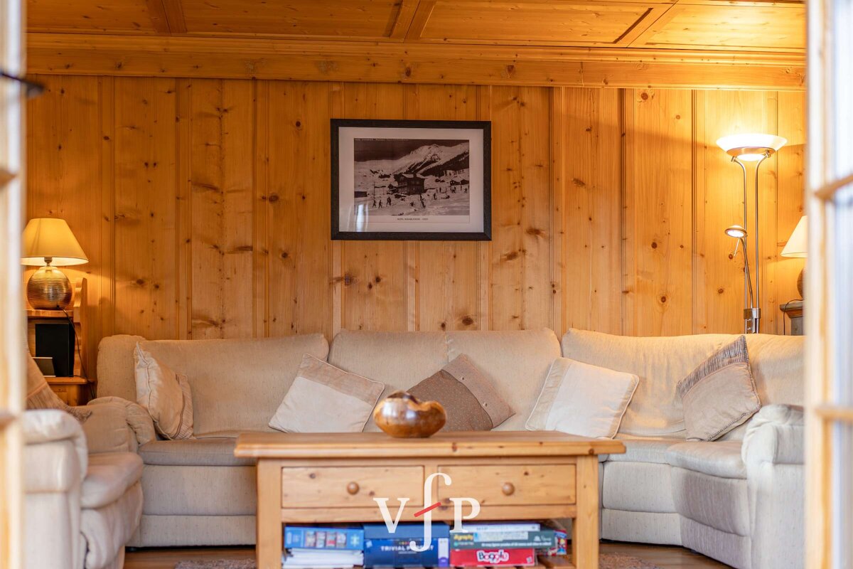 A living room with a picture on the wall that says vip