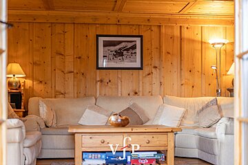 A living room with a picture on the wall that says vip