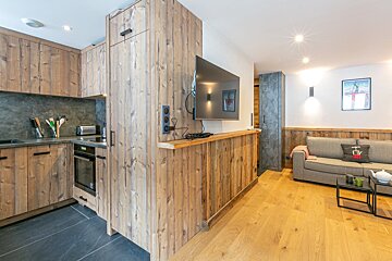 A living room with a couch and a television