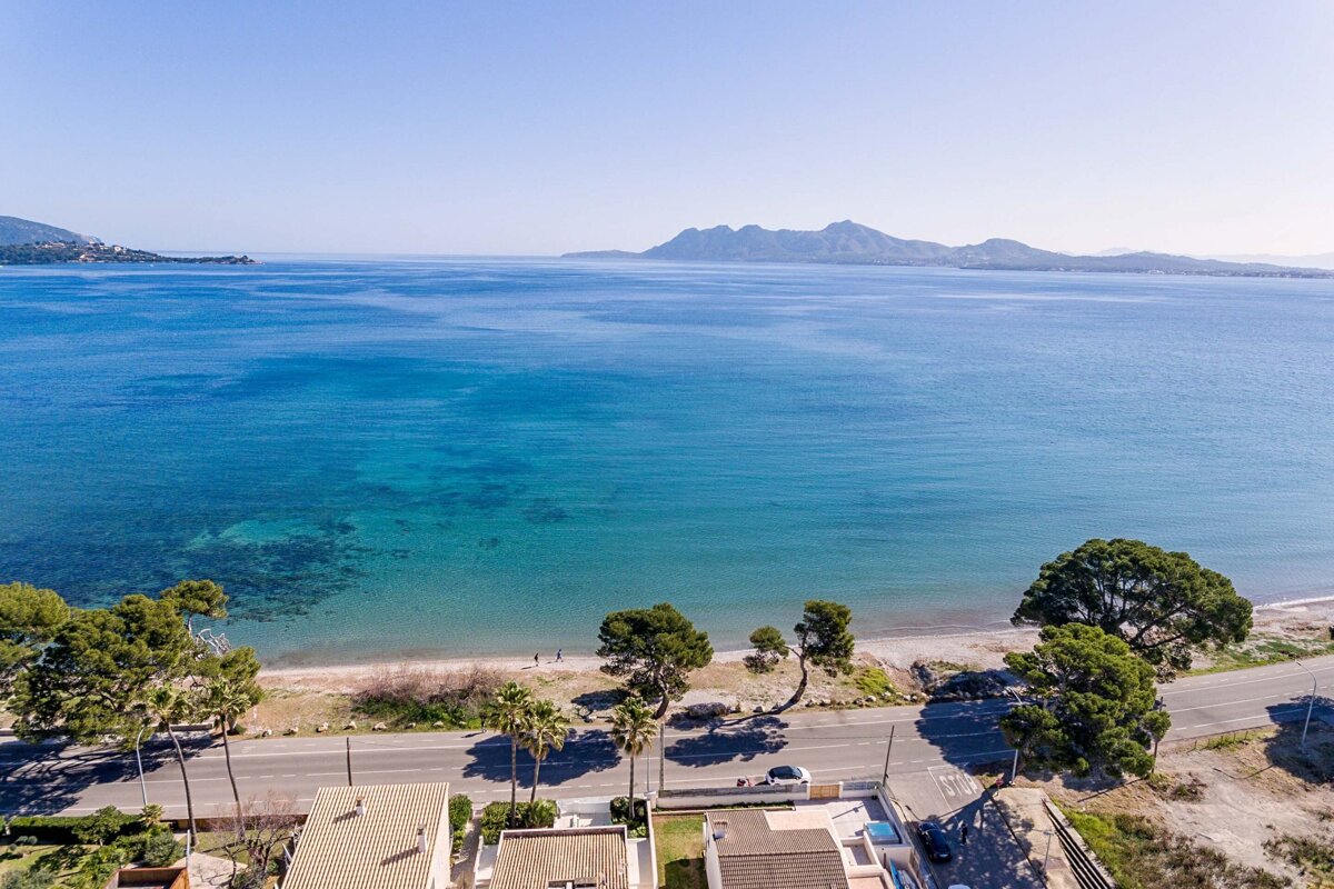 A large body of water with mountains in the background