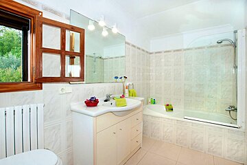 A bathroom with a sink a toilet and a bathtub