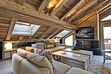 A living room with a couch and two coffee tables