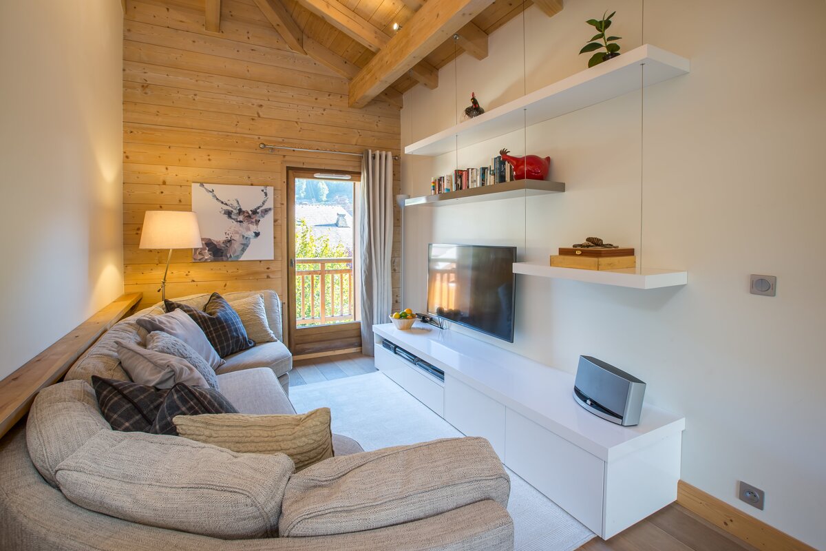 A living room with a couch and a television