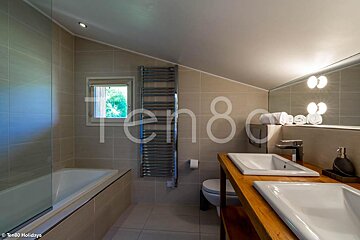 A bathroom with the number ten80 on the wall