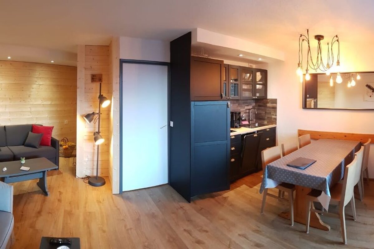 A living room with a couch and a table