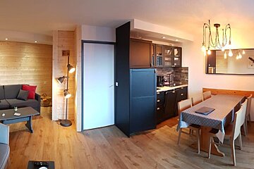 A living room with a couch and a table