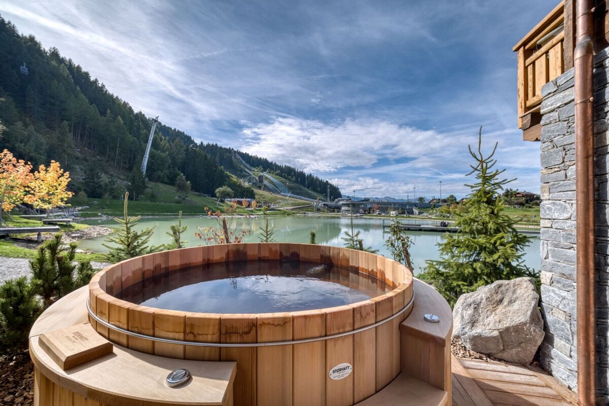 A wooden hot tub with a label that says ' nordic ' on it