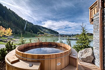 A wooden hot tub with a label that says ' nordic ' on it