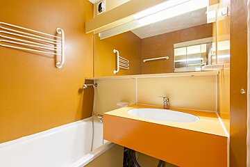 A bathroom with a sink and a bathtub