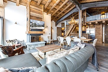 A living room with a fireplace and a flat screen tv