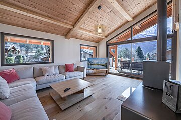 A living room filled with furniture and a fireplace