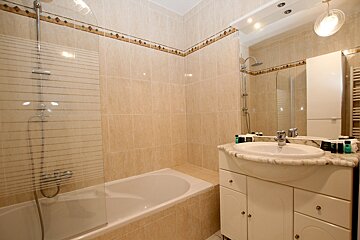 A bathroom with a sink and a bathtub