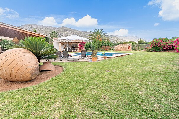 A house with a swimming pool in the backyard