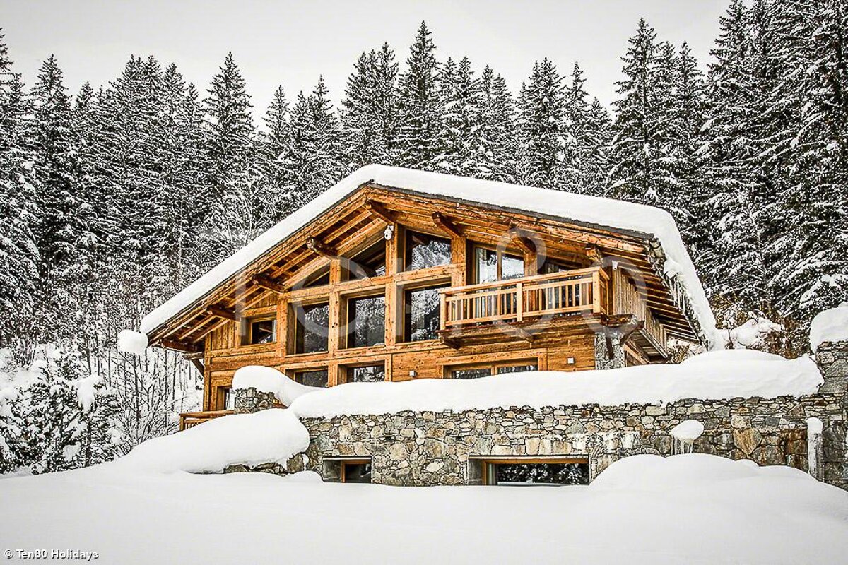 A photo of a snowy cabin taken by holidays