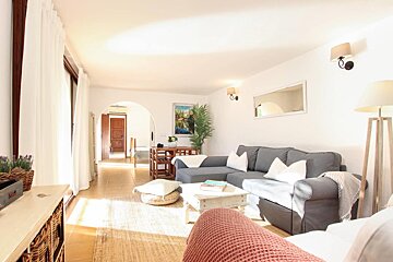 A living room with a couch and a table