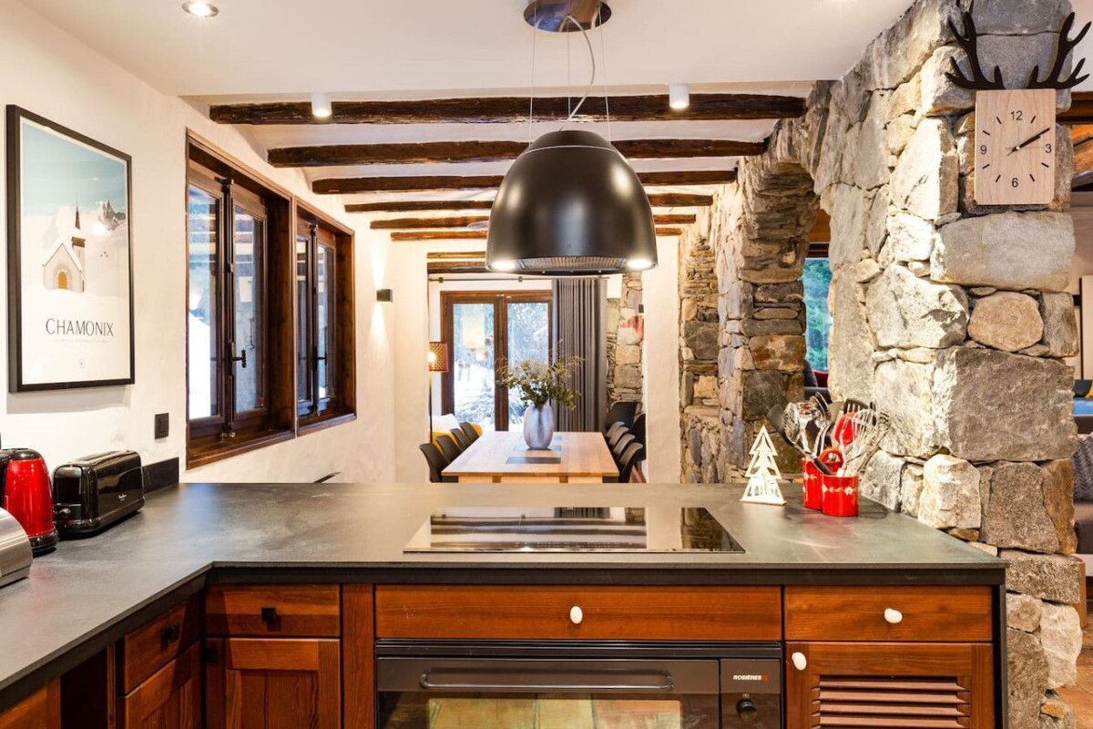 A kitchen with a poster that says chamonix on it