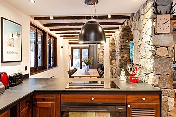A kitchen with a poster that says chamonix on it