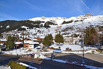 A snowy landscape with a sign that says ' altitude ' on it