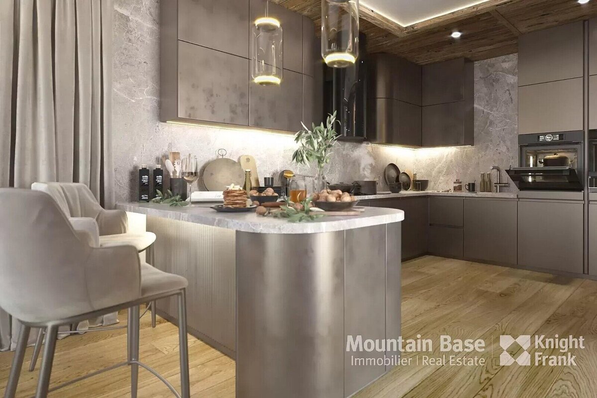 A luxurious, modern kitchen features dark cabinetry, marble walls, a light wood floor, and a rustic wood ceiling. A curved island with bar stools displays food, illuminated by pendant lights.