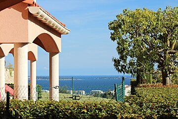 A view of the ocean from a fenced in area