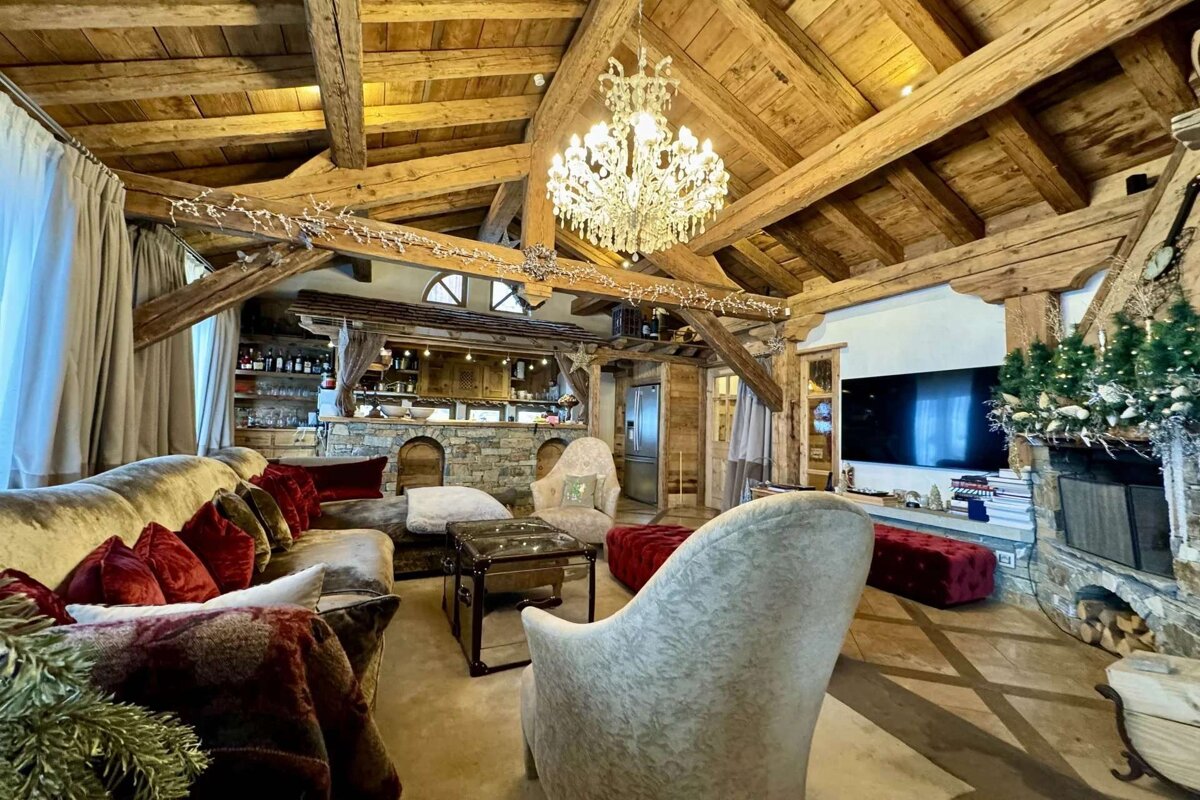 A living room filled with furniture and a chandelier