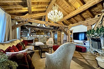 A living room filled with furniture and a chandelier