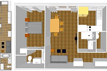 An aerial view of a house with a dining table and chairs