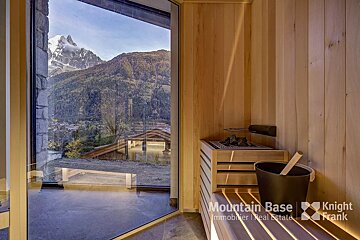 A sauna with a view of the mountains is sponsored by mountain base