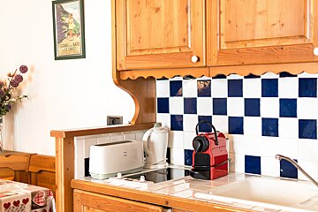 A kitchen with a toaster and a nespresso machine