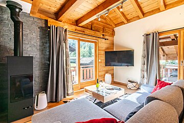A living room with a couch and a flat screen tv