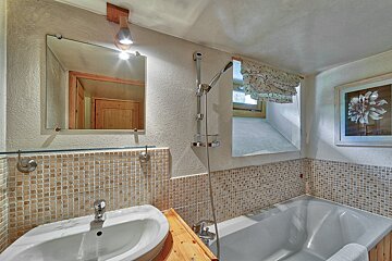 A bathroom with a sink and a bathtub