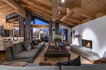 A living room filled with furniture and a fireplace