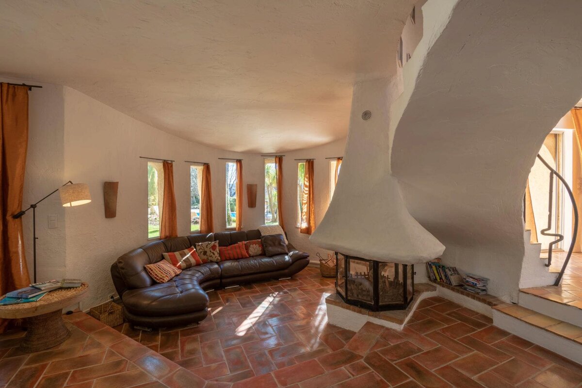 A living room with a couch and a fireplace