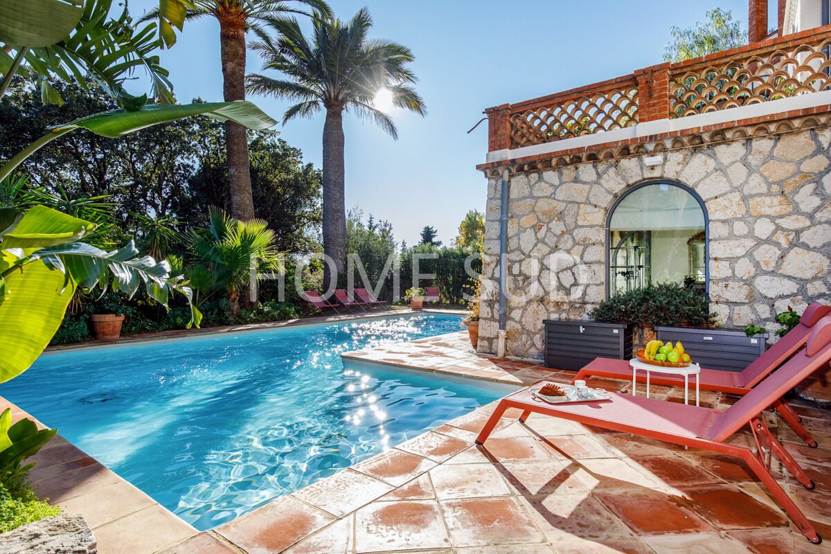 A swimming pool with the word home on the side of it