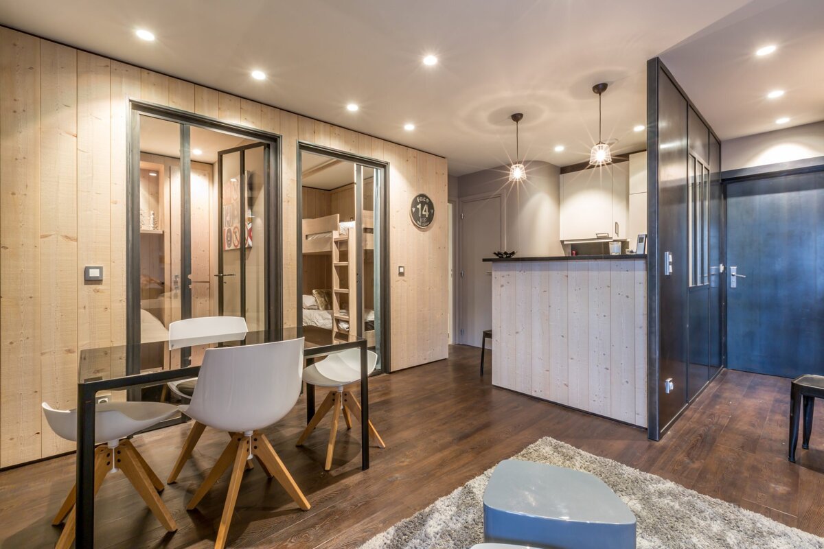 A living room with a couch and a green table