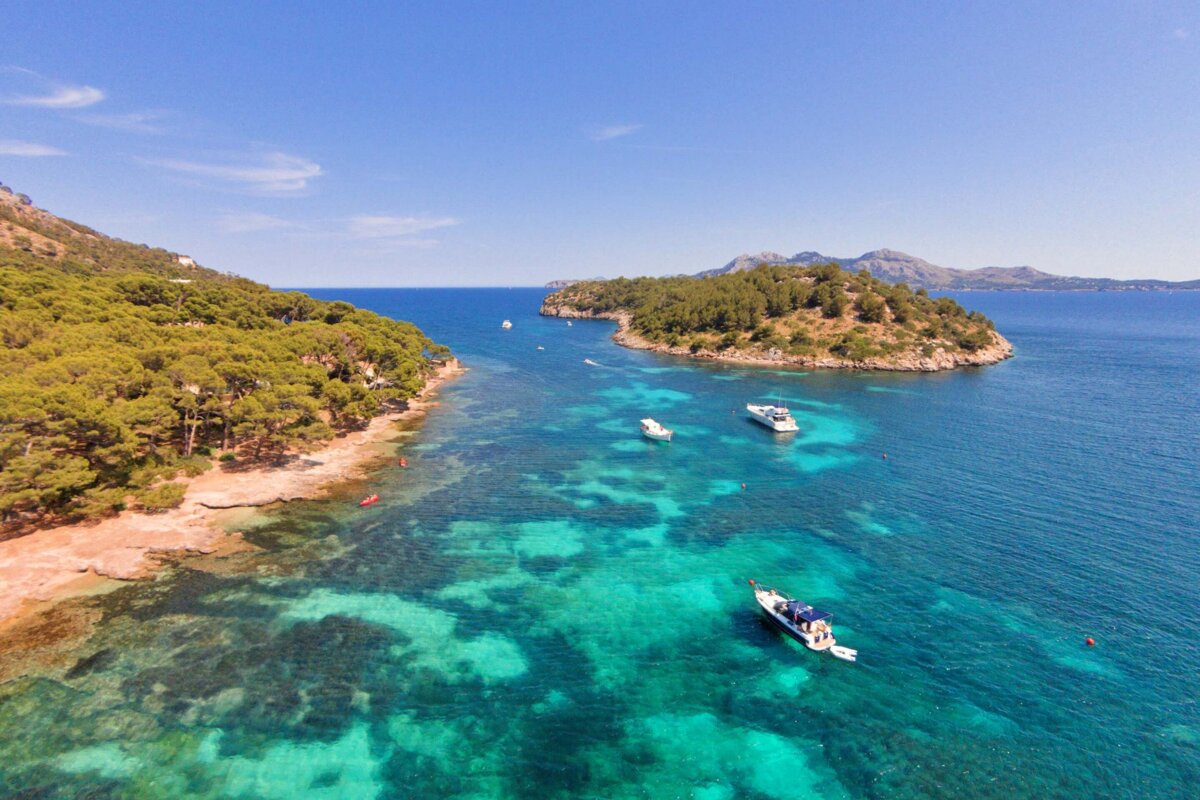 A small island in the middle of a large body of water