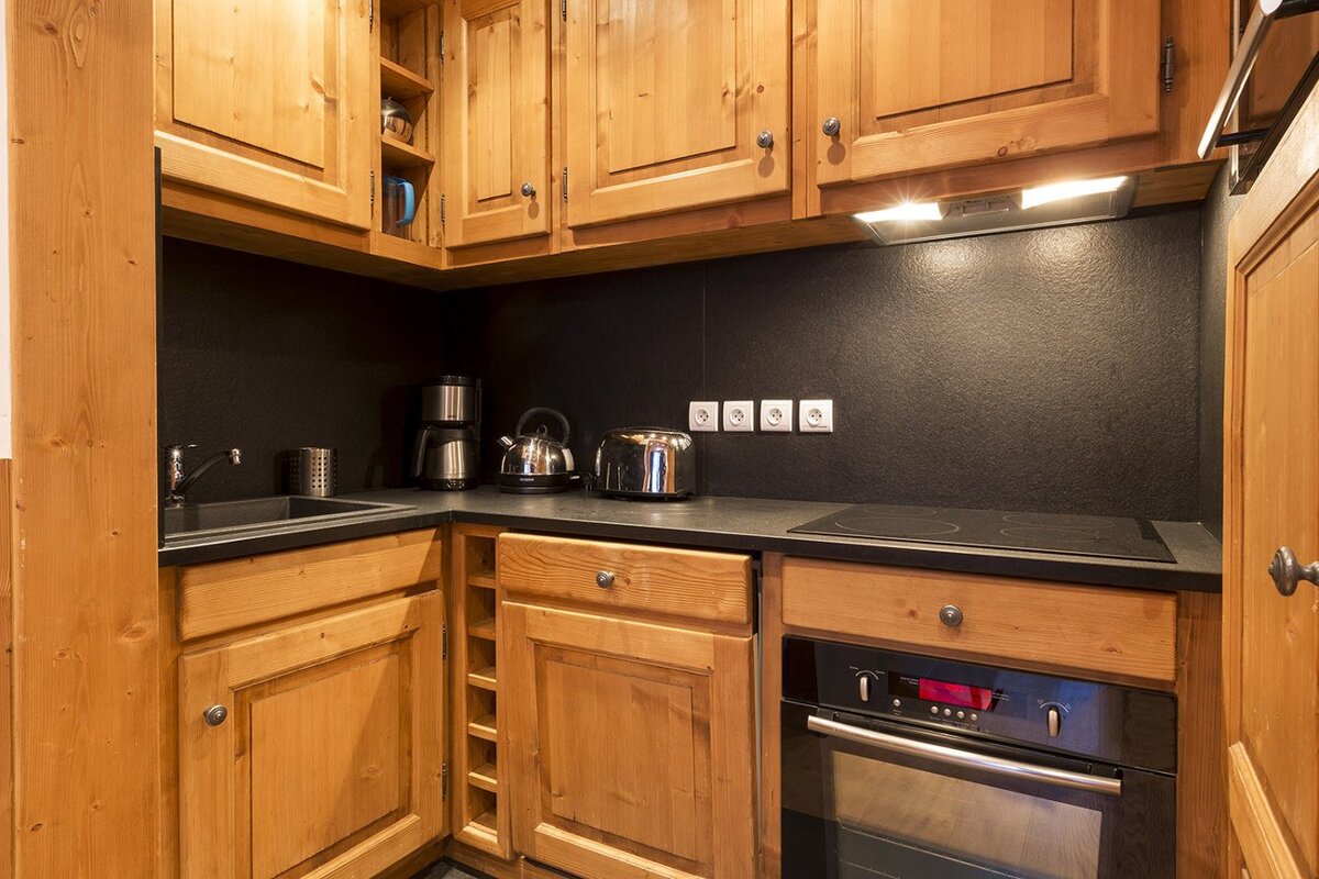 A living room with a dining table and chairs